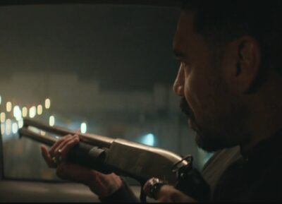 Mayans MC S5x05 Angel takes aim during the drive by shooting on the SOA