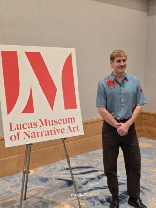 2026-07-23 Ryan Linkof with sign at SDCC 2026