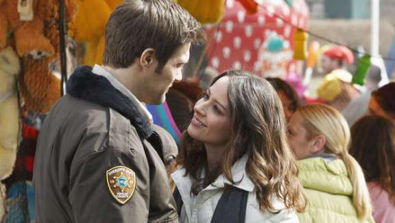 Happy Town -Amy Acker above with Geoff Stults